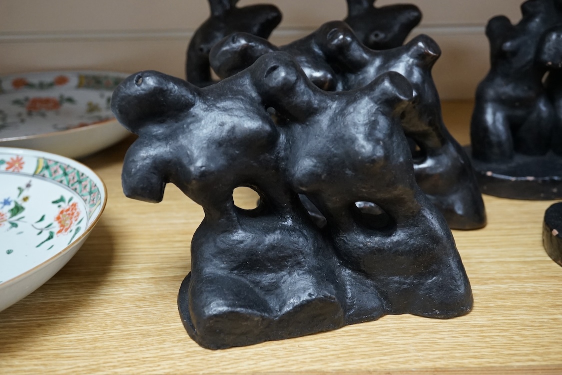 Three pairs of small black figural abstract sculptures, together with two similar sculptures. (8). Tallest 15cm high
